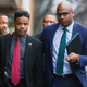University of Virginia student Martese Johnson (left, foreground) and his lawyer, Daniel Watkins, March 26, 2015, in Charlottesville, Va.
Zach Gibson/Getty Images